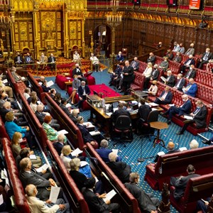 A busy House of Lords chamber with members filling the benches