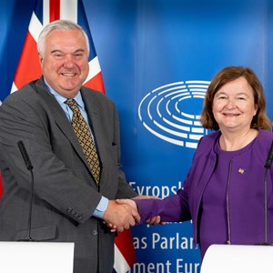 Co-Chairs of the PPA shaking hands in front of UK and EU flags