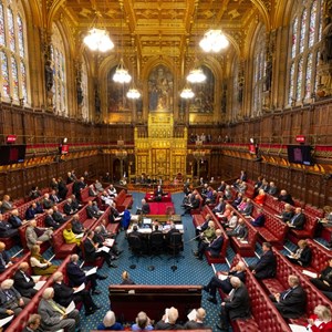 A busy House of Lords chamber looking towards the throne