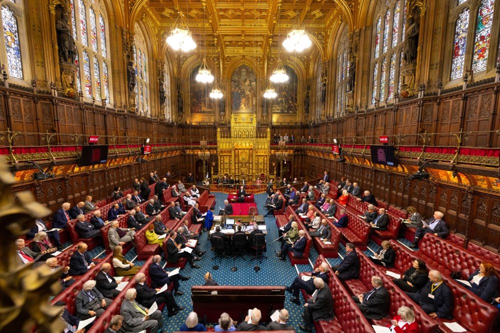 A busy House of Lords chamber looking towards the throne